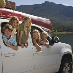 Kids hanging out of back of SUV